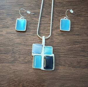 Matching necklace and earrings. Silver with blue glass accents
